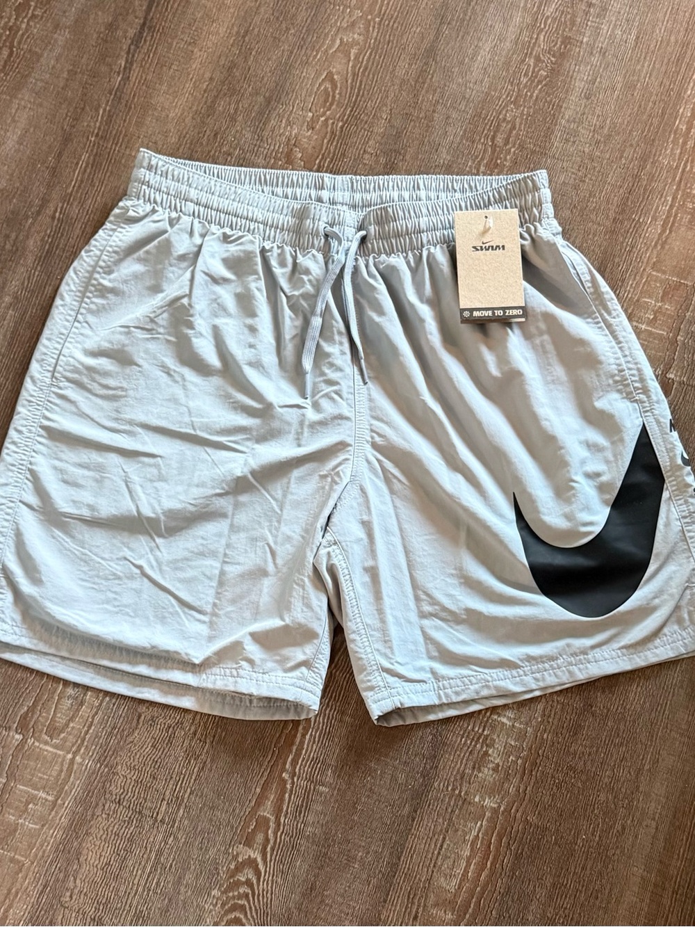 Nike Men’s Light Gray Athletic Shorts with Black Swoosh